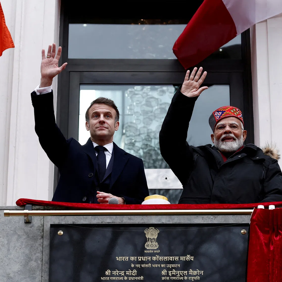 FILE PHOTO: French President Emmanuel Macron and Indian Prime Minister Narendra Modi wave from the balcony during the inauguration of the Indian Consulate as part of a visit in Marseille, France, February 12, 2025.  REUTERS/Christian Hartmann/Pool/File Photo