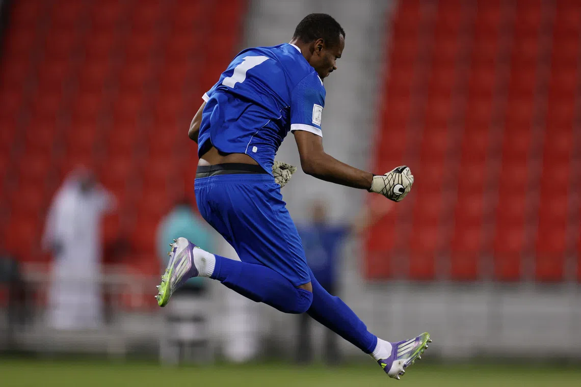 Soccer Football - FIFA Arab Cup - Qatar 2025 - Qualifying - Comoros v Yemen - Grand Hamad Stadium, Doha, Qatar - November 26, 2025 Comoros' Adel Anzimati celebrates after saving a penalty during the penalty shootout REUTERS/Thaier Al-Sudani