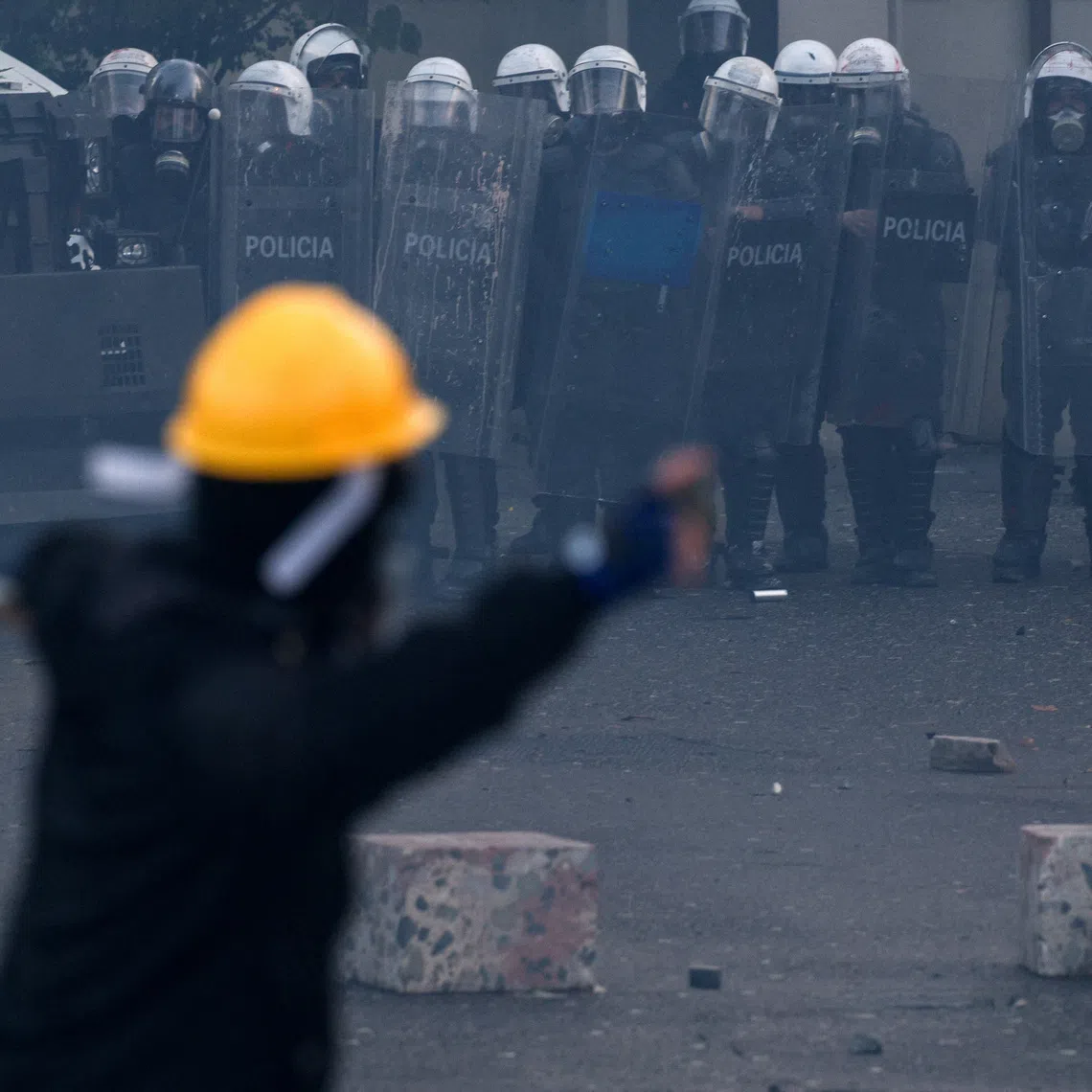 Police officers in riot gear stand next to an armoured vehicle during an anti-government protest by students in Tirana, Albania, October 24, 2026. REUTERS/Florion Goga