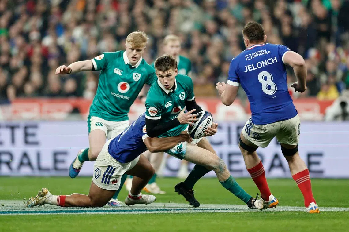 Rugby Union - Six Nations Championship - France v Ireland - Stade de France, Saint-Denis, France - February 5, 2026 Ireland's Sam Prendergast in action with France's Yoram Moefana REUTERS/Benoit Tessier