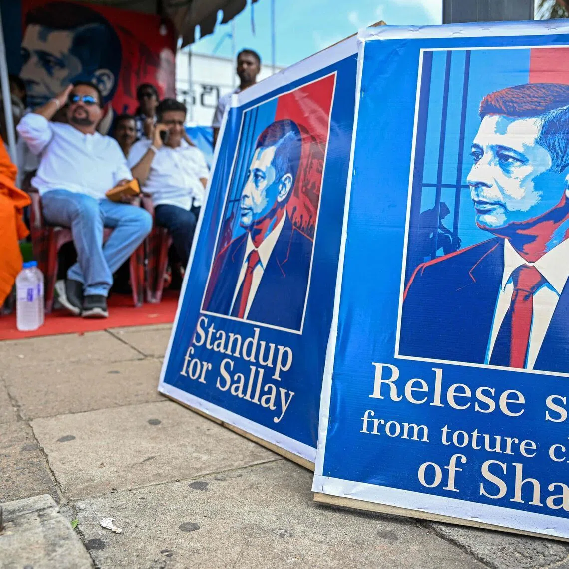 (FILES) Sri Lanka's opposition activists take part in a sit-in protest to demand the release of detained former intelligence chief Suresh Sallay, outside a railway station in Colombo on June 10, 2026. Retired Sri Lankan major general and counterterrorism expert Suresh Sallay has addressed the Pentagon and the United Nations on subjects including social media's role in "radicalisation, extremism, and terrorism". But the island's former spy chief was himself arrested under anti-terrorism laws in February 2026 and accused by the government of masterminding the 2019 Easter bombings, the deadliest attack against civilians in Sri Lanka's history. (Photo by Ishara S. KODIKARA / AFP)