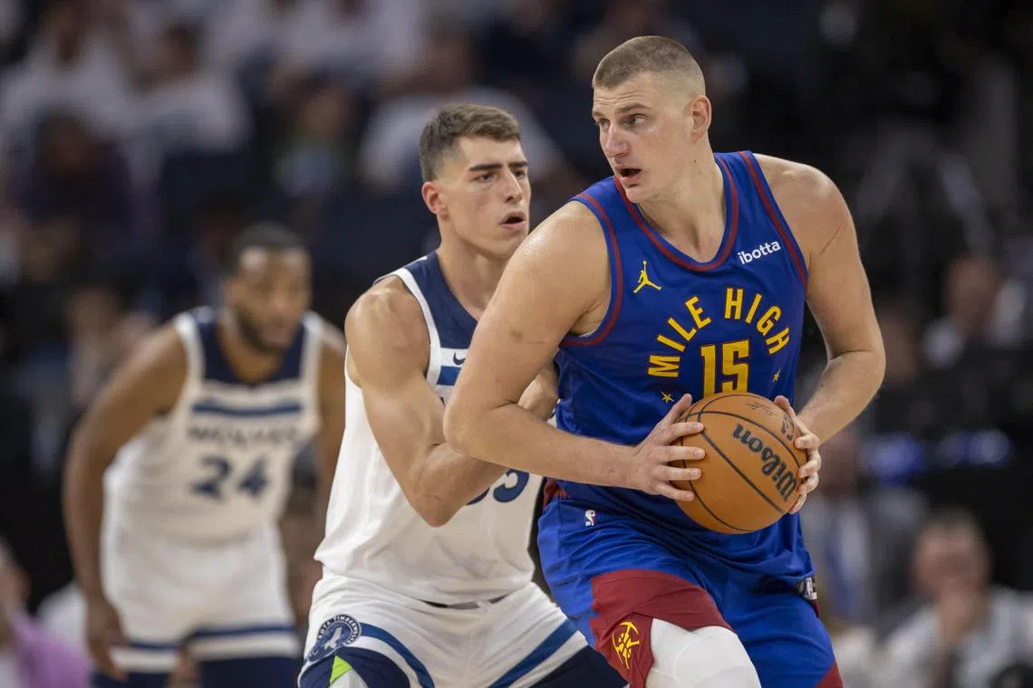Denver Nuggets centre Nikola Jokic controls the ball as Minnesota Timberwolves centre Luka Garza defends in the second half during Game 3 of the NBA Western Conference semi-finals.