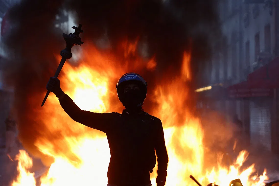 Clad in all black and with faces covered, ultra-left agitators are blamed by officials of transforming peaceful protests into widespread looting.