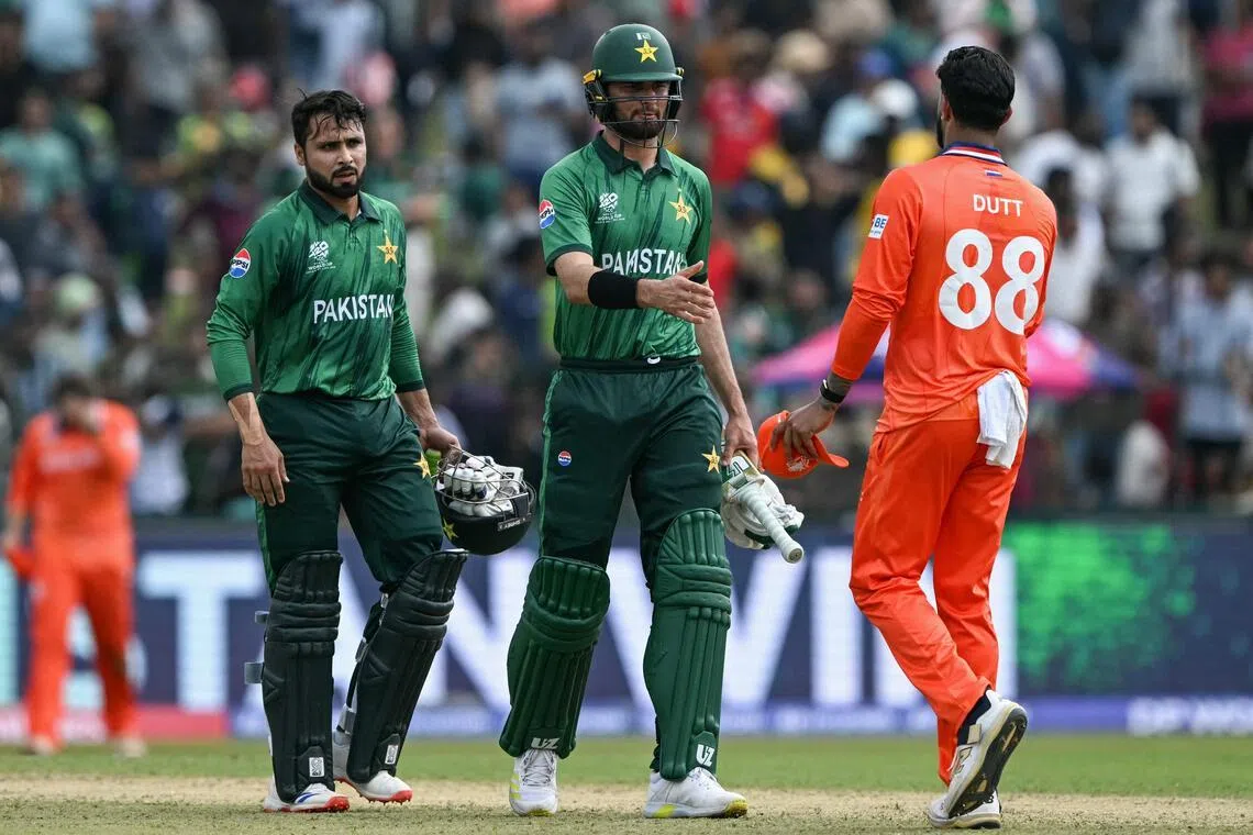 Pakistan's Shaheen Shah Afridi (centre) and Faheem Ashraf are congratulated by the Netherlands' Aryan Dutt for their group-stage win in the ICC Men's T20 Cricket World Cup at the Sinhalese Sports Club Ground in Colombo on Feb 7, 2026.