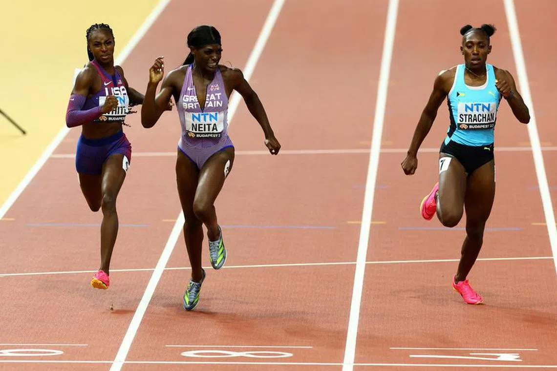 Athletics - World Athletics Championship - Women's 200m - National Athletics Centre, Budapest, Hungary - August 24, 2023 Kayla White of the U.S., Britain's Daryll Neita and Bahamas' Anthonique Strachan in action during heat 2 REUTERS/Bernadett Szabo