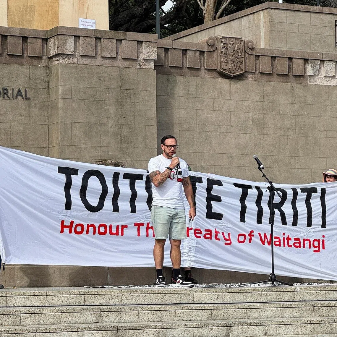 Anaru Ryall speaks at a protest demanding New Zealand's government to honour the Treaty of Waitangi in Wellington, New Zealand, February 6, 2025. REUTERS/Lucy Craymer