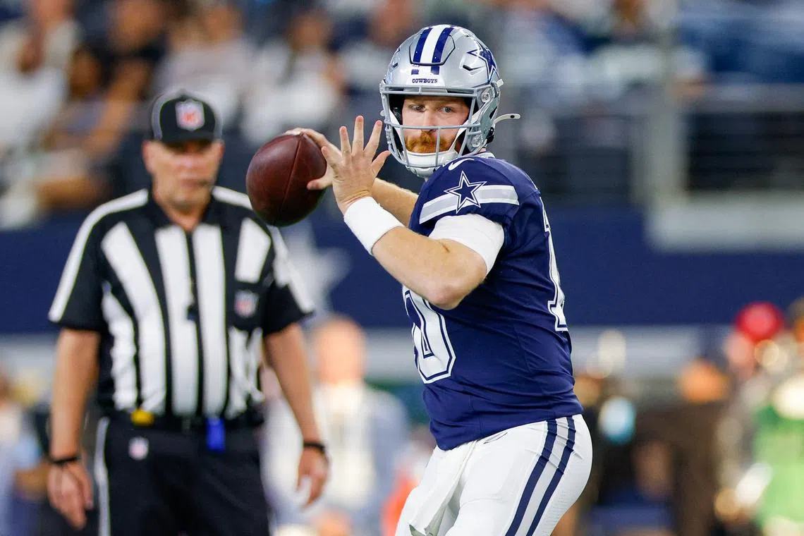 FILE PHOTO: Oct 13, 2024; Arlington, Texas, USA; Dallas Cowboys quarterback Cooper Rush (10) drops back to pass during the fourth quarter against the Detroit Lions at AT&T Stadium. Mandatory Credit: Andrew Dieb-Imagn Images/File Photo