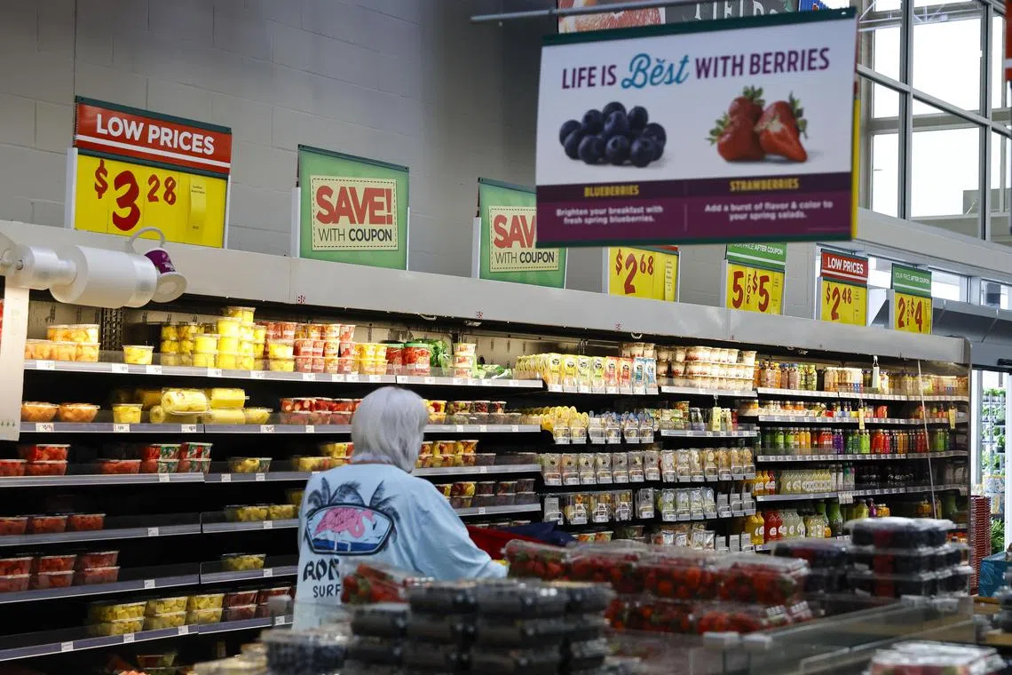 epa11288920 A customer walks past the fresh fruit section at a H-E-B supermarket in Austin, Texas, USA, 19 April 2024. According to a report from the Consumer Goods, strawberries, frozen strawberries, green beans, bell peppers, blueberries and potatoes were mostly affected by mass amounts of pesticides. Most of these products arrived from Mexico.  EPA-EFE/Adam Davis