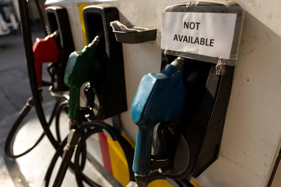 A “not available” sign is posted on a fuel dispenser at a petrol station in Quezon city, in the Philippines.