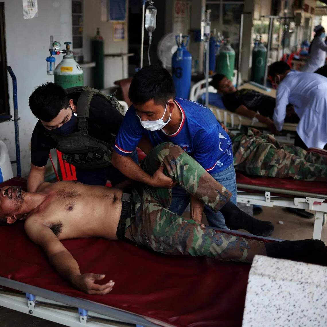 A wounded Cambodian soldier arrives at a hospital in Cambodia’s Banteay Meanchey province.    
