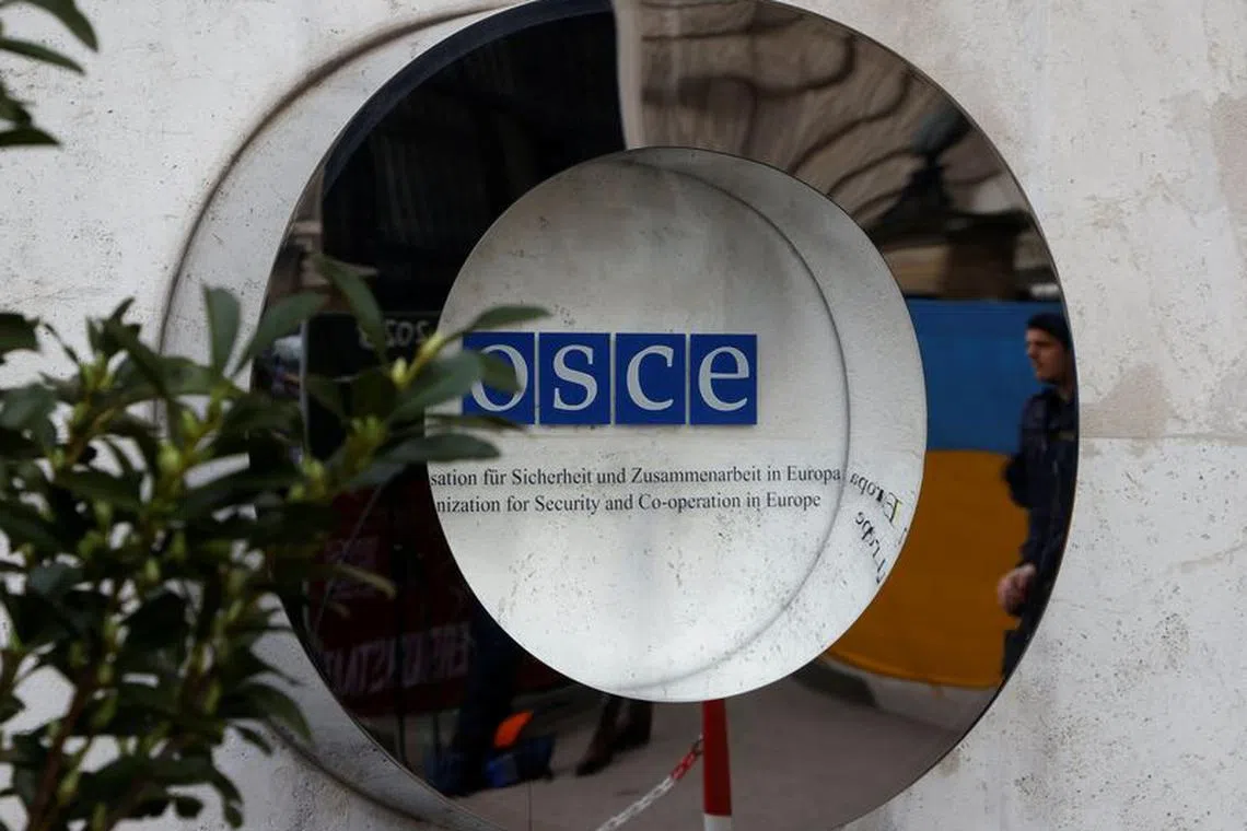 The OSCE sign is seen outside Hofburg Palace as a Parliamentary Assembly of the Organization for Security and Cooperation in Europe (OSCE) takes place in Vienna, Austria, February 23, 2023. REUTERS/Leonhard Foeger/File Photo