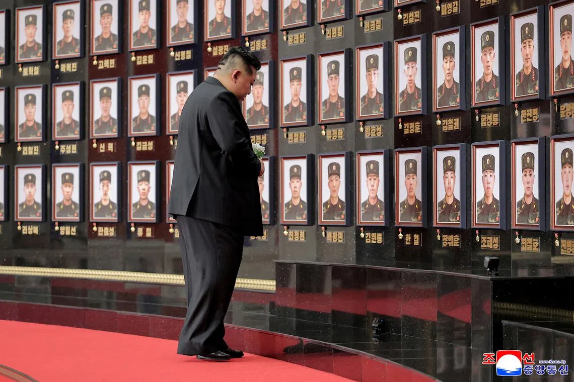 FILE PHOTO: North Korean leader Kim Jong pays homage to the soldiers killed during operations as he attends a national commendation ceremony for the commanders and fighters of the Korean People's Army's overseas operations unit, at  the headquarters of the Central Committee of the Korean Workers' Party,  in Pyongyang, North Korea, in this photo released on August 22, 2025 by North Korea's Korean Central News Agency (KCNA). KCNA via REUTERS/ File Photo
