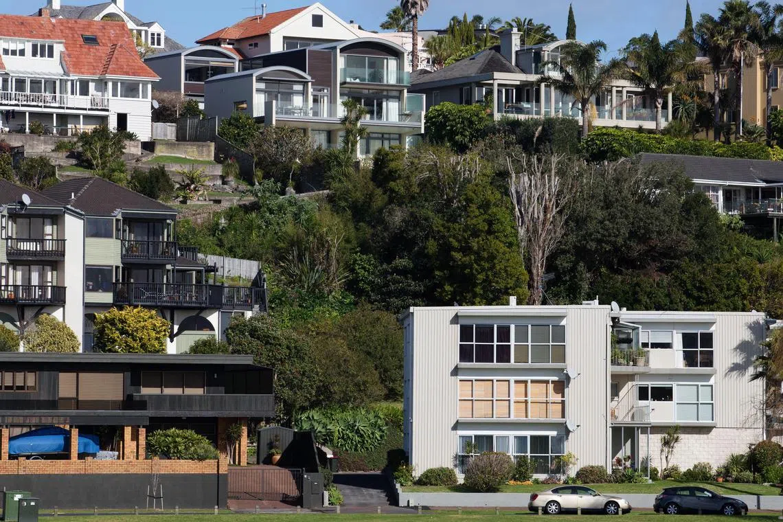 New Zealand posted a record fall in house prices in the year through March as soaring interest rates and slowing economic growth pushed buyers to the sidelines.