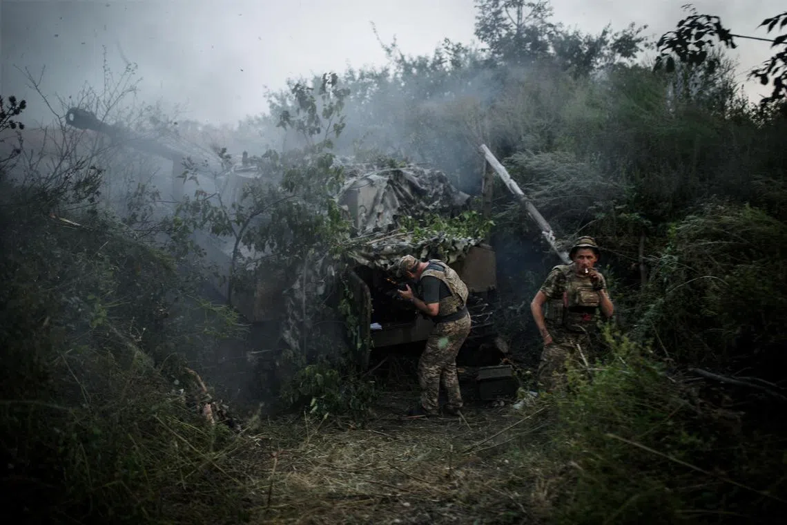 Ukrainian soldiers fire shells at a Russian position in the Bahkmut region of Ukraine.