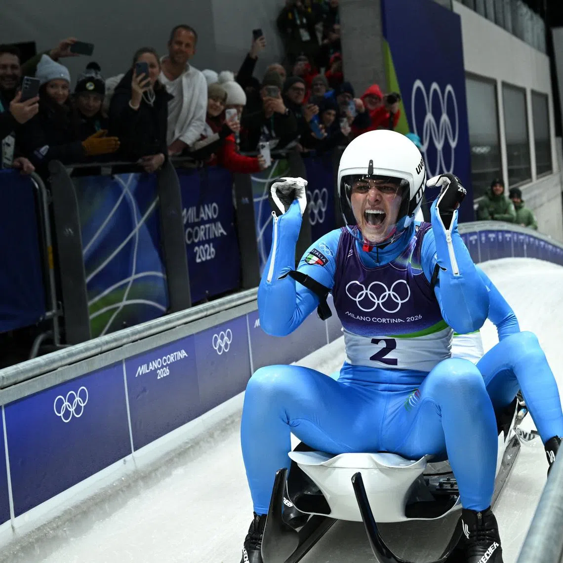 Milano Cortina 2026 Olympics - Luge - Women's Doubles Run 2 - Cortina Sliding Centre, Cortina d'Ampezzo, Italy - February 11, 2026. Andrea Voetter of Italy and Marion Oberhofer of Italy react after their run during Women's Doubles Run 2. REUTERS/Annegret Hilse