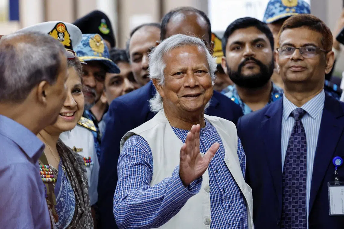 Dr Yunus greets supporters as he arrived at the Hazarat Shahjalal International Airport, in Dhaka, Bangladesh.
