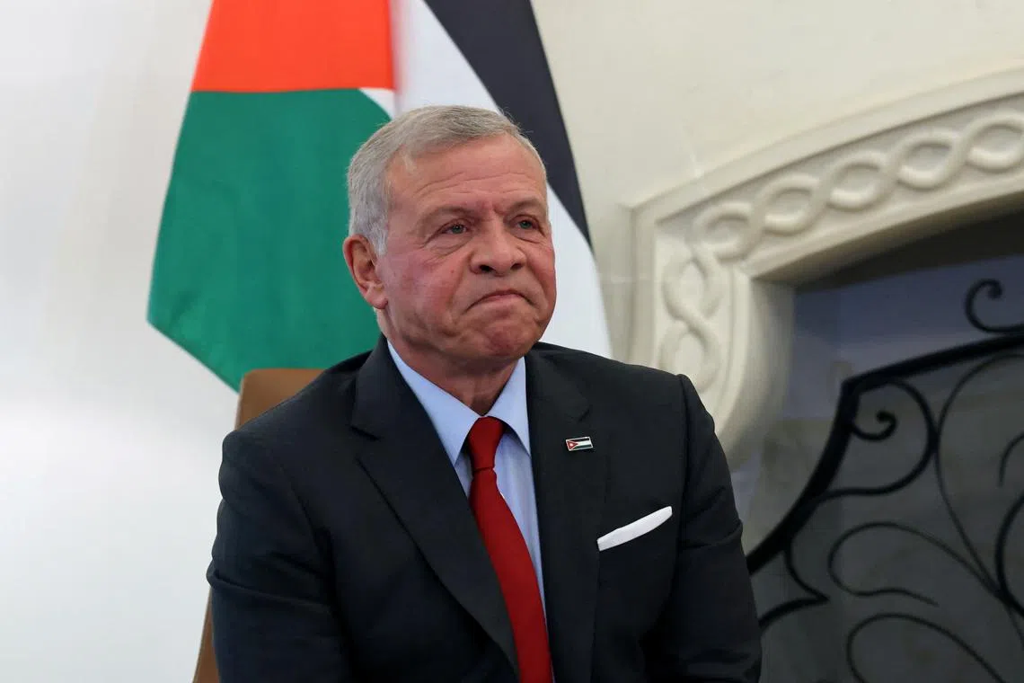 FILE PHOTO: Jordan's King Abdullah talks with Cyprus' President Nikos Christodoulides (not pictured) during a trilateral summit between Greece, Cyprus and Jordan at the Presidential Palace in Nicosia, Cyprus, November 27, 2024.  REUTERS/Yiannis Kourtoglou/Pool/File Photo