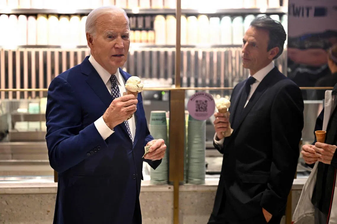 Mr Biden speaks with host Seth Meyers as they enjoy an ice cream at Van Leeuwen Ice Cream store after taping an episode of "Late Night with Seth Meyers" in New York City.
