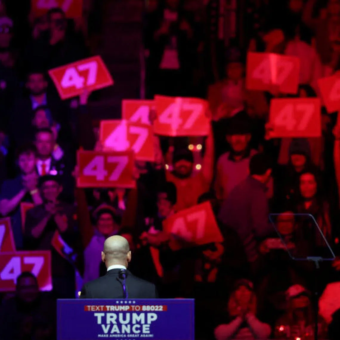 Stephen Miller turns towards attendees holding placards reading "47" during a rally for U.S. President-elect Donald Trump the day before he is scheduled to be inaugurated for a second term, in Washington, U.S., January 19, 2025. REUTERS/Evelyn Hockstein