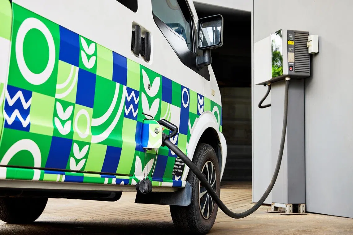 bnl electric van being charged, part of the company’s fleet electrification efforts across its 24/7 cleaning, landscaping, and waste management divisions