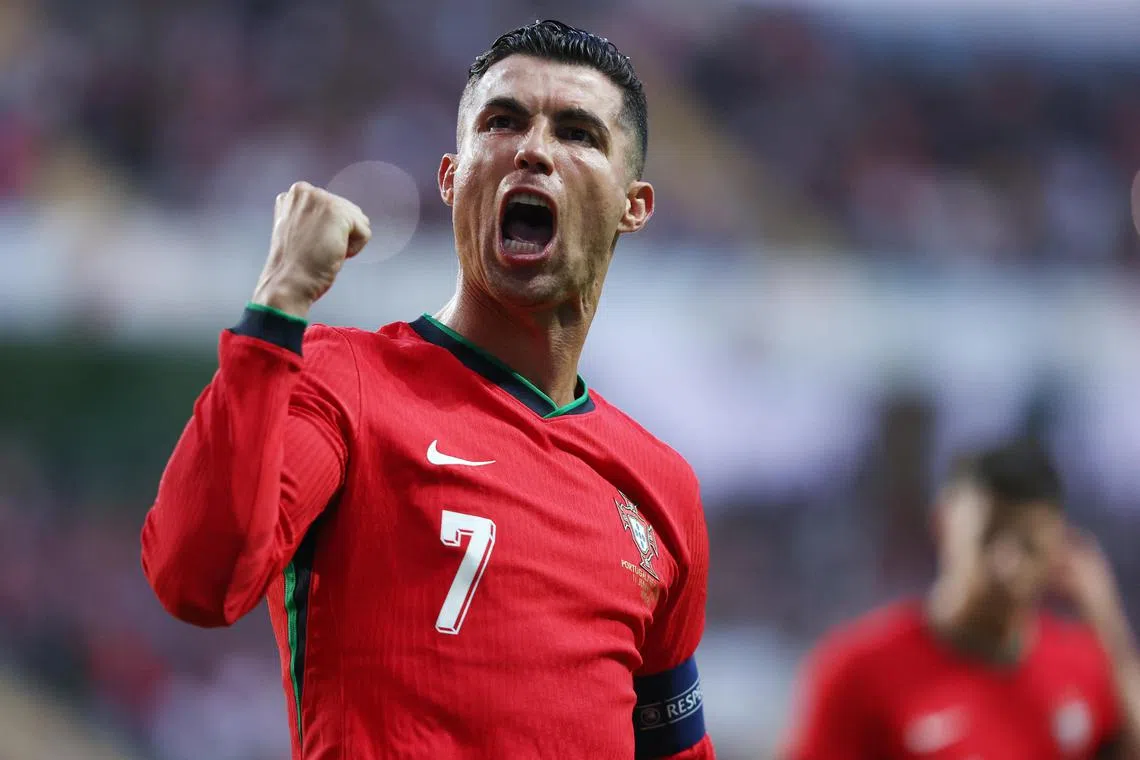 Portugal's Cristiano Ronaldo celebrates scoring their third goal.