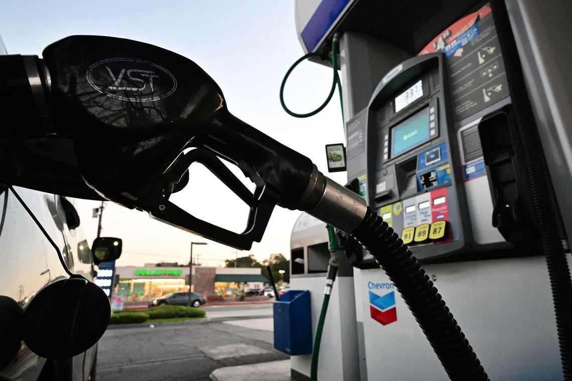 Oil prices rose to three-week highs as China relaxed travel rules and freezing weather across the United States prompted refinery closures