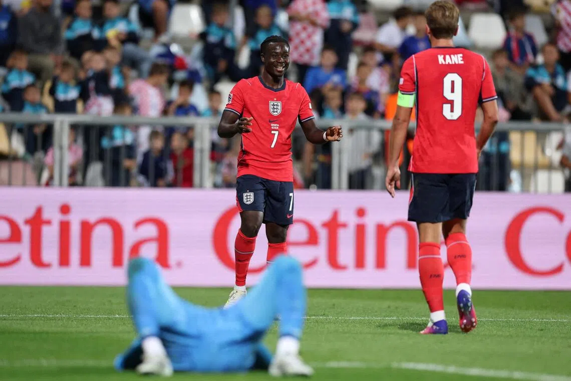 England’s Bukayo Saka celebrates scoring their sixth goal against Croatia with Harry Kane.