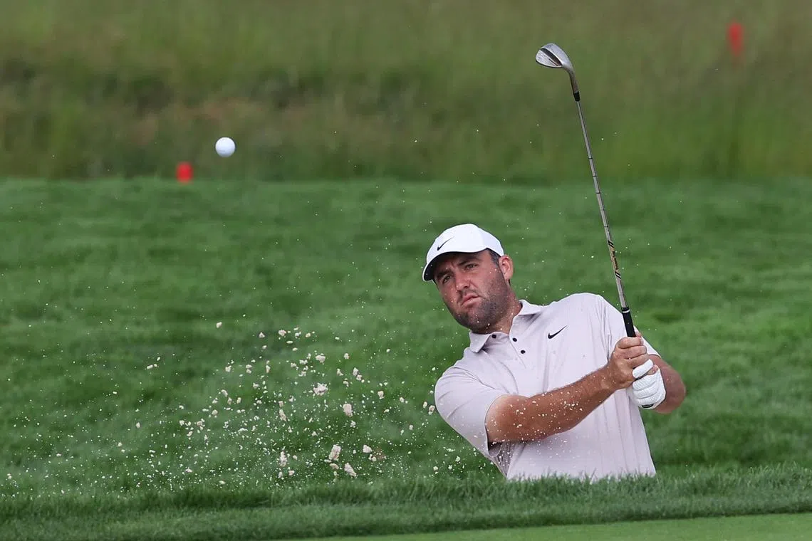 Scottie Scheffler hits out of a bunker on the second hole during a practice round for the US Open.