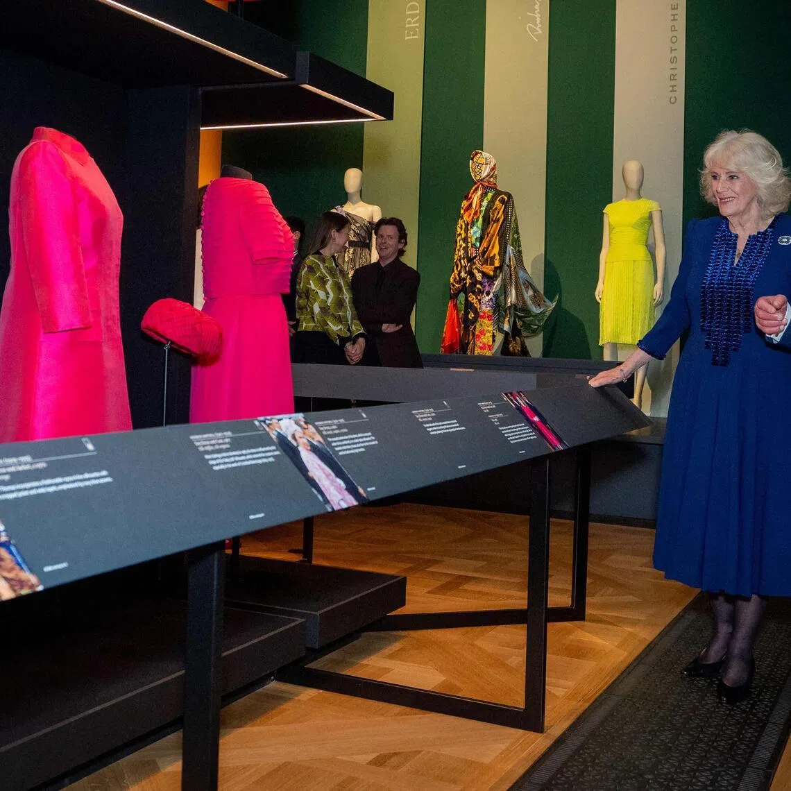 Britain's King Charles III and Britain's Queen Camilla viewing exhibits including outfits worn by his late mother Queen Elizabeth II, in the new Royal Collection Trust exhibition: Queen Elizabeth II: Her Life in Style, in The King's Gallery at Buckingham Palace in London on April 20, 2026. 