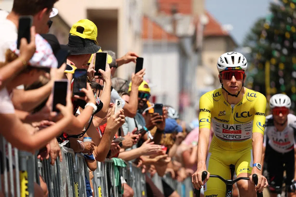 Cycling - Tour de France - Stage 15 - Champagnole to Plateau de Solaison - Champagnole, France - July 19, 2026 UAE Team Emirates - XRG's Tadej Pogacar wearing the yellow jersey before the start of stage 15 REUTERS/Gonzalo Fuentes