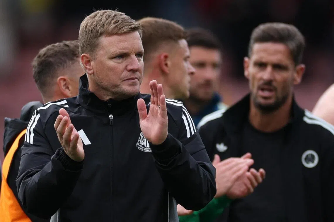 Newcastle United manager Eddie Howe applauds fans after the match.