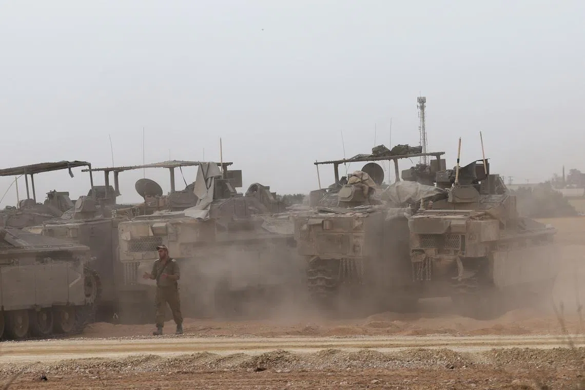 Israeli APCs at a gathering location on the southern Israeli border with the Gaza Strip near Rafah, on April 25.