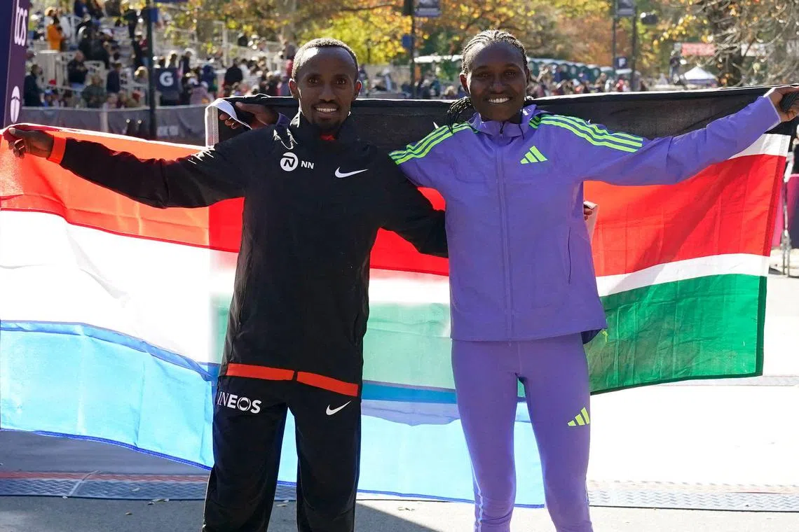 Men’s New York Marathon winner Abdi Nageeye (left) of the Netherlands and women’s winner Sheila Chepkirui of Kenya posing on Nov 3.