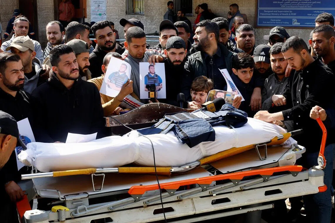 Mourners attend the funeral of Al Jazeera journalist Ahmed Wishah, who was killed in an Israeli strike on June 17, 2026.

