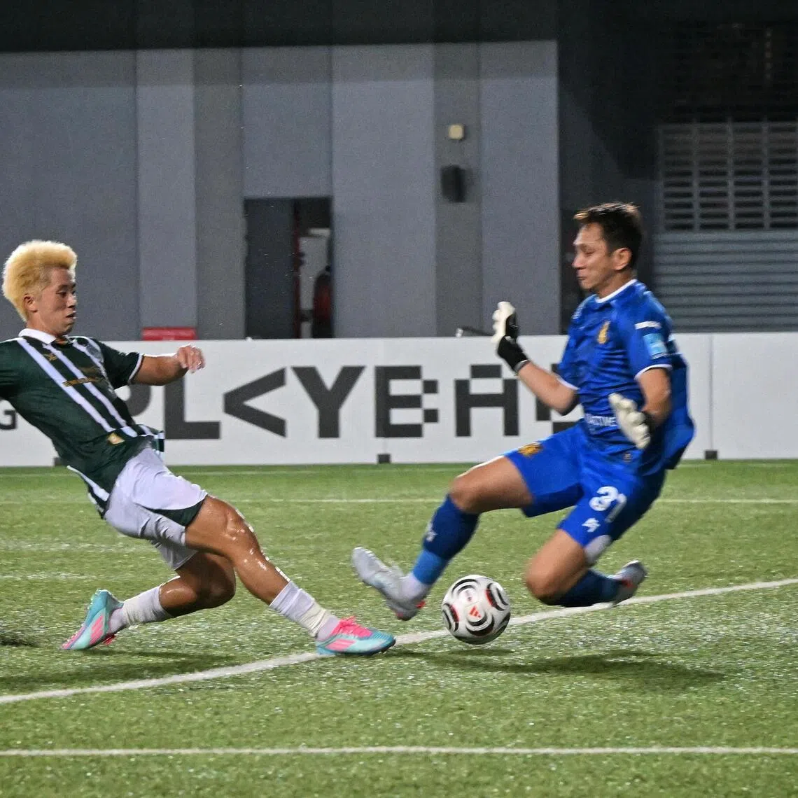 Singapore Premier League match between (in gree) Geylang International and (in orange) Hougang United, at Our Tampines Hub, on Oct 26. 2026.