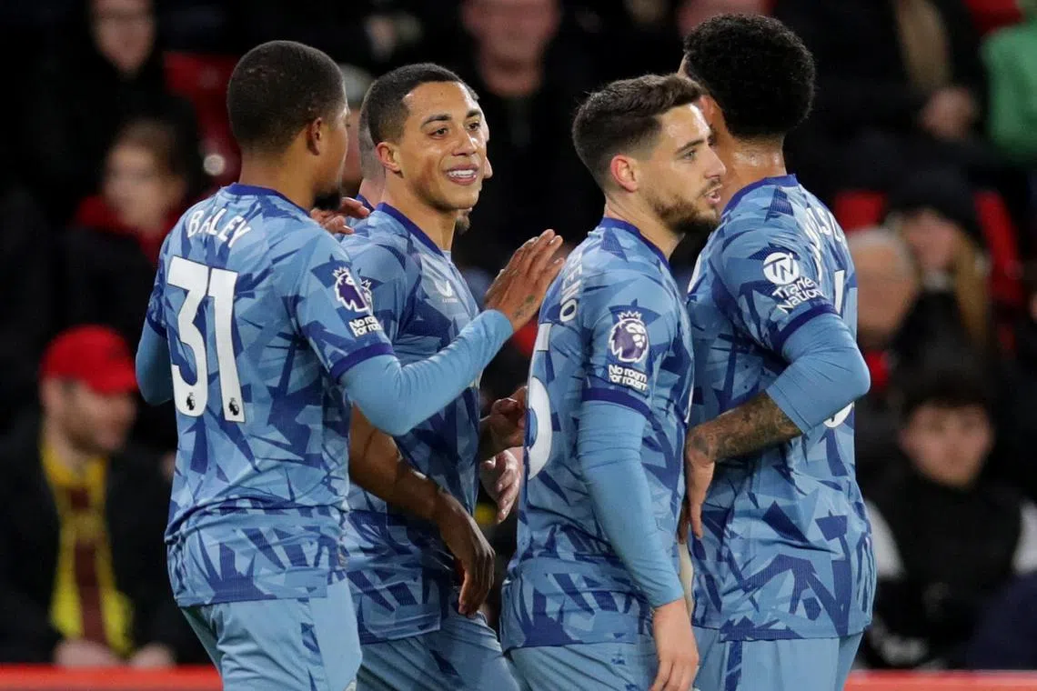 Aston Villa's Leon Bailey celebrates scoring their third goal with teammates.