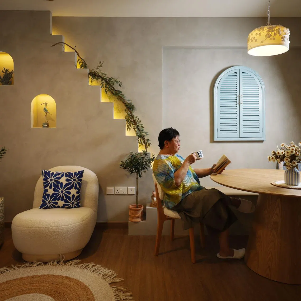 Retiree Ivy Lim chose a Mediterranean theme for her flat in Pasir Ris, with design elements such as a mock staircase and arches. 
