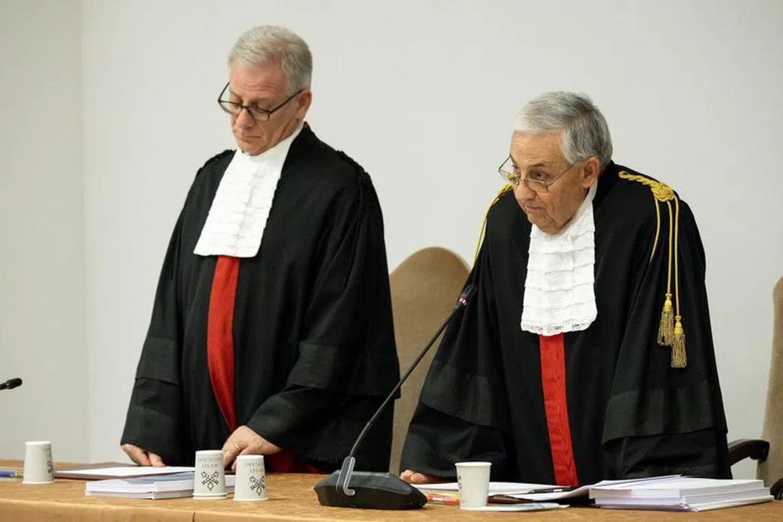 Judge Giuseppe Pignatone reads the verdict of the Vatican corruption trial, at the Vatican, December 16, 2023.   Vatican Media/Handout via REUTERS