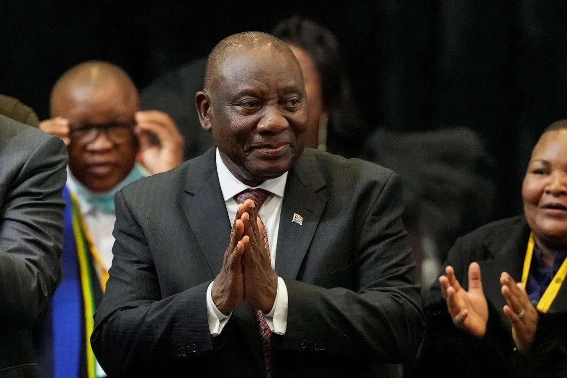 FILE PHOTO: South African president Cyril Ramaphosa reacts after being re-elected as president of South Africa during the first sitting of the National Assembly following elections at the Cape Town International Convention Center (CTICC) in Cape Town, South Africa June 14, 2024. REUTERS/Nic Bothma/File Photo
