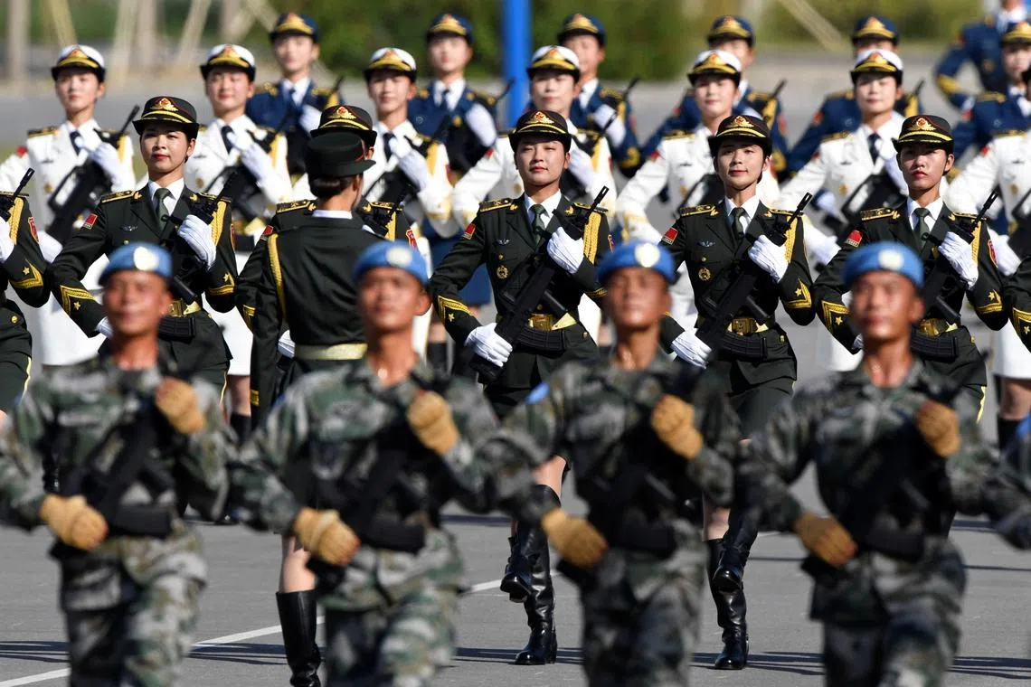FILE PHOTO: Chinese soldiers practice marching in formation ahead of a military parade in Beijing, China, September 25, 2019. Naohiko Hatta/Pool via REUTERS/File Photo