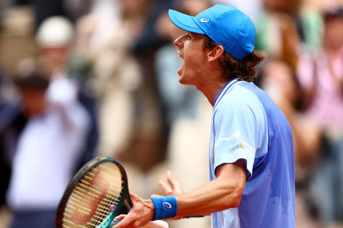 Australia's Alex de Minaur reacting after winning his French Open fourth-round match against Russia's Daniil Medvedev at Roland Garros on June 3.