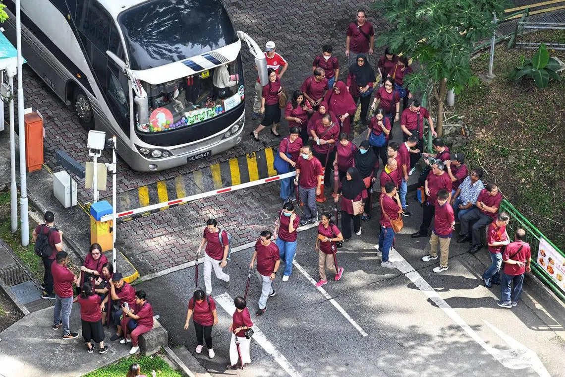 Supporters arriving by bus at Jalan Besar Stadium next to PA HQ.