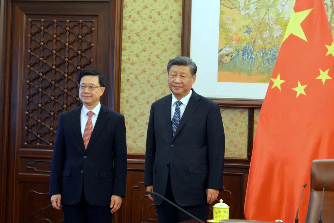 Chinese President Xi Jinping (right) and Hong Kong’s leader John Lee met in Beijing on Friday.