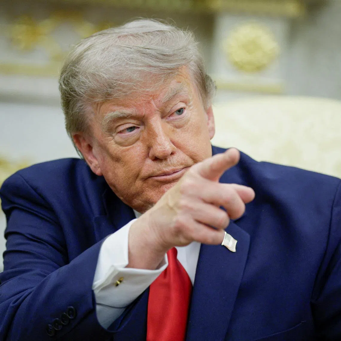U.S. President Donald Trump points his finger as he participates in a bilateral meeting with Iraqi Prime Minister Ali al-Zaidi (not pictured) in the Oval Office at the White House in Washington, D.C., U.S., July 14, 2026. REUTERS/Evan Vucci