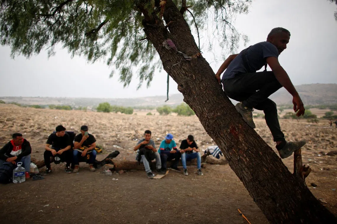 Migrants, mostly from Venezuela, waiting at the site known as El Basurero, a stretch of land next to a trash dump and the railroad, for a train to continue their journey to the U.S. border in Huehuetoca, State of Mexico, Mexico on April 26. Migrants are vulnerable to gangs, cold nights and sweltering days. The latest wave of people are largely poor Venezuelans, including families with small children, mostly aiming to reach Ciudad Juarez, opposite the Texan city of El Paso.