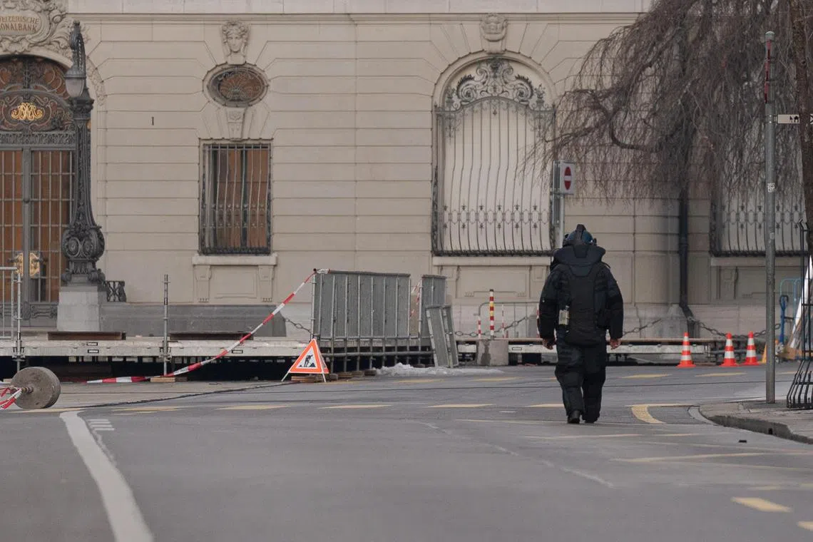 An explosives expert carries out a search near the Swiss Parliament, on Feb 14, 2023.