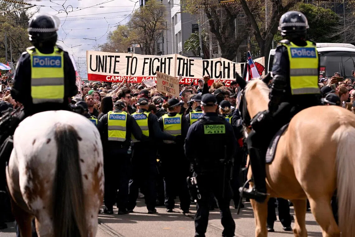 In Melbourne, local media reported tense confrontations between protesters and police as rival groups turned on each other.