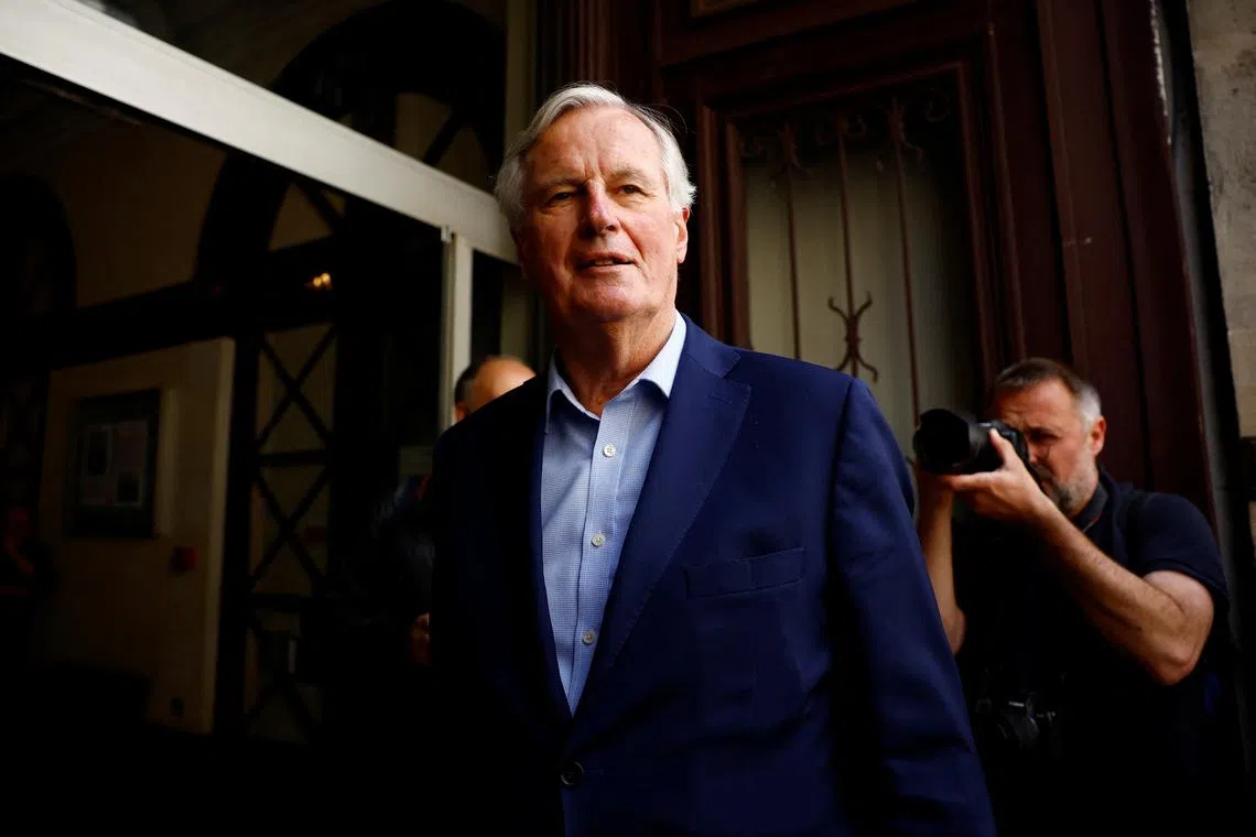 FILE PHOTO: Michel Barnier of the French conservative party Les Republicains (The Republicans - LR) arrives to attend an emergency meeting called by LR party chiefs in Paris, following their leader Eric Ciotti's decision to form an alliance between his party's candidates and the far-right National Rally (Rassemblement National - RN) in a snap parliamentary election, France, June 12, 2024. REUTERS/Sarah Meyssonnier/File Photo
