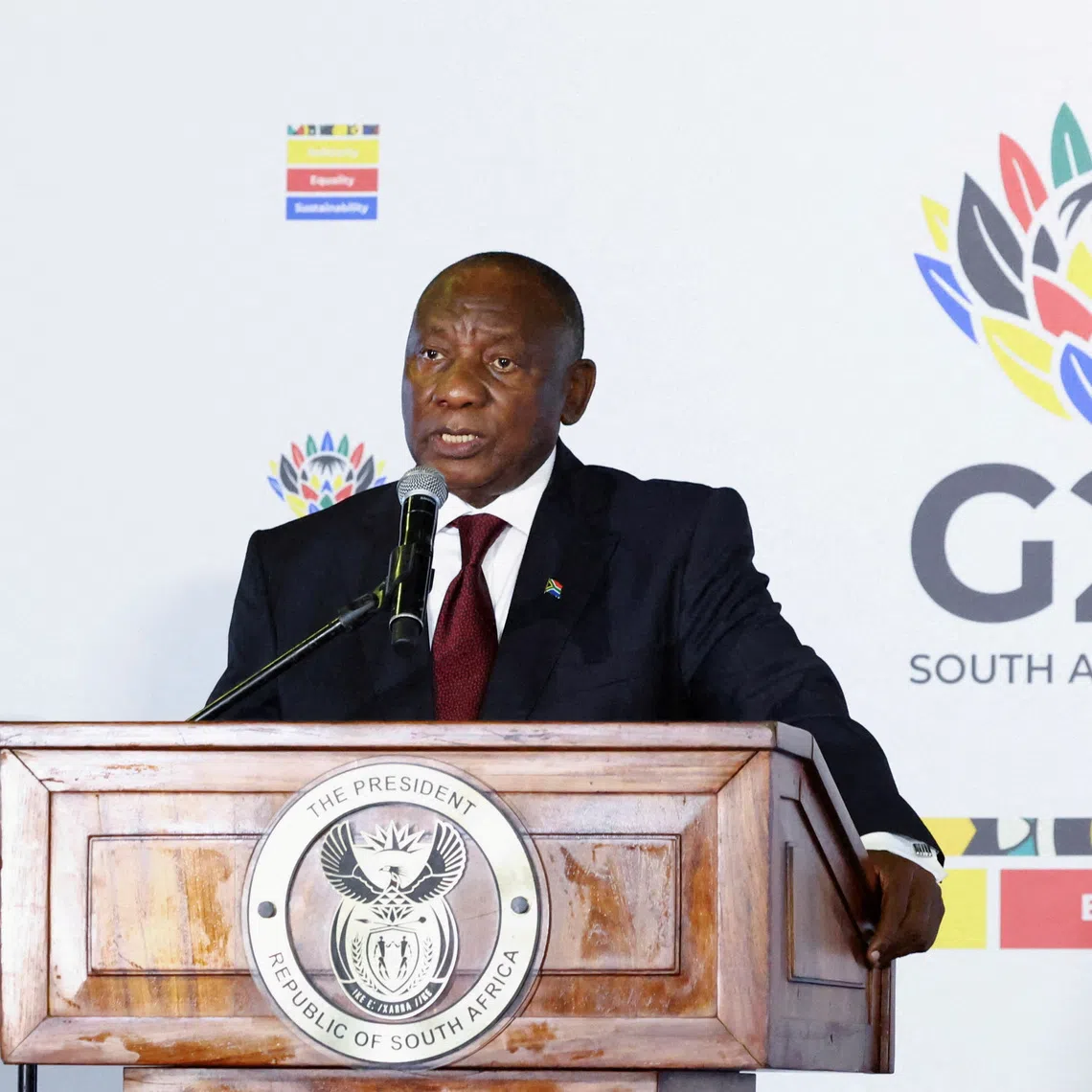 South African President Cyril Ramaphosa speaks to members of the media on the sidelines of the meeting of the G20 foreign ministers, which is hosted by South Africa under the theme \"Solidarity, Equality and Sustainability\", at the NASREC conference centre in Johannesburg, South Africa, February 20, 2025. REUTERS/Siphiwe Sibeko