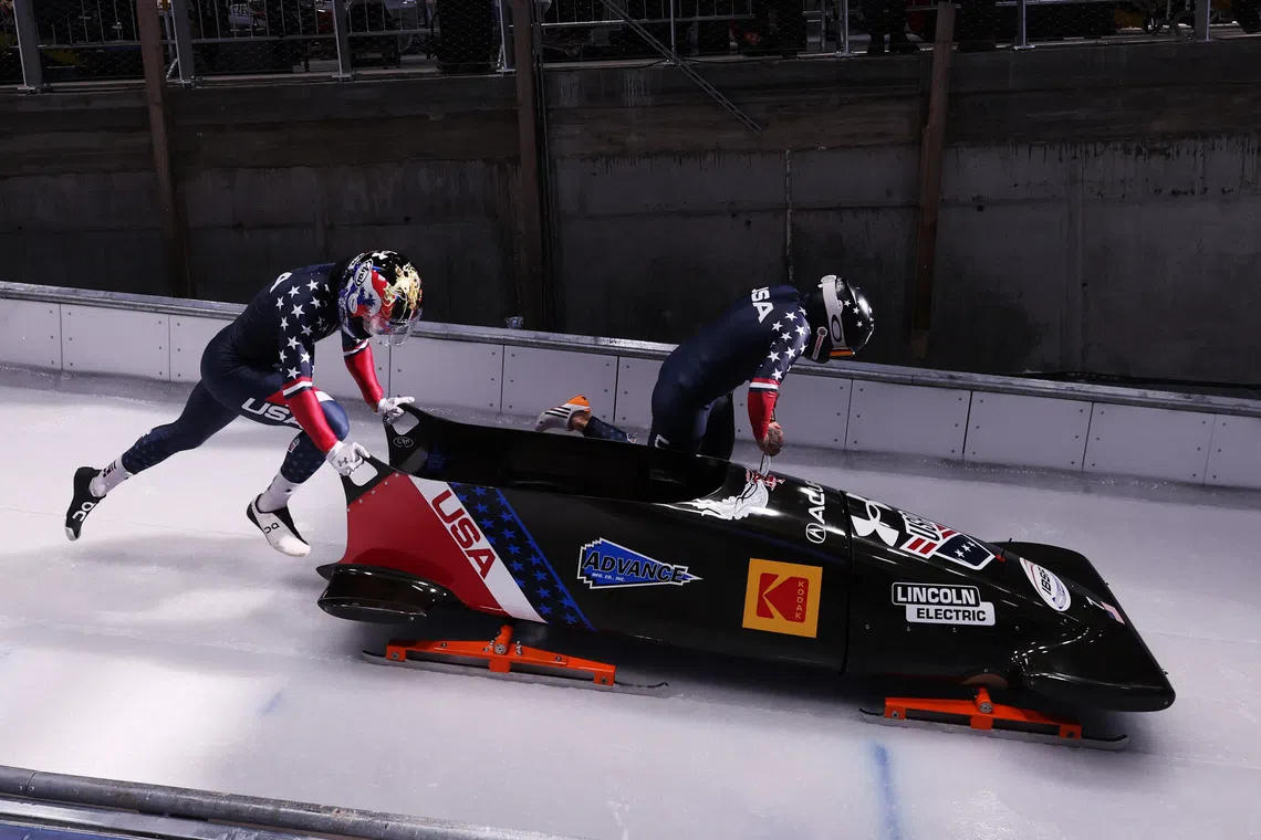 Olympics - 2026 Milano-Cortina Winter Olympics - Test Event - IBSF World Cup - 2 Woman Bobsleigh - Cortina Sliding Centre, Cortina d'Ampezzo, Italy - November 23, 2025 Kaillie Humphries and Sylvia Hoffman of the U.S. in action during heat 1 REUTERS/Claudia Greco